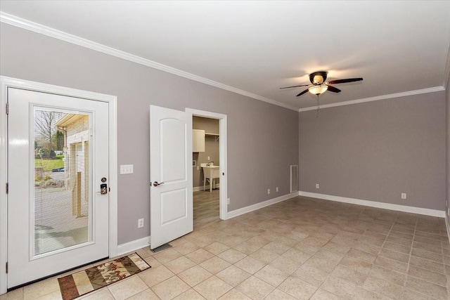 unfurnished room with a ceiling fan, baseboards, and crown molding