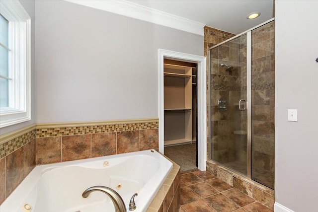 full bath with a whirlpool tub, a stall shower, a walk in closet, and crown molding