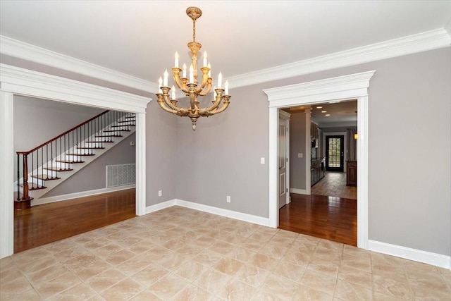 unfurnished room with light wood finished floors, visible vents, baseboards, stairs, and crown molding