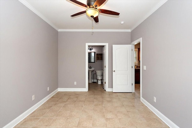 unfurnished bedroom featuring ceiling fan, connected bathroom, baseboards, and crown molding