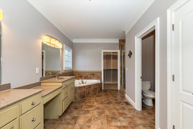 full bath with toilet, ornamental molding, a garden tub, a spacious closet, and vanity