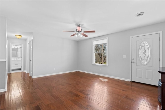 foyer with baseboards, visible vents, dark wood finished floors, and a ceiling fan