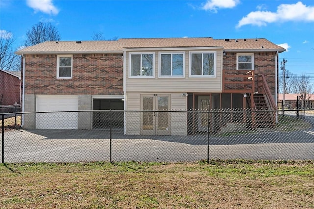 back of house with a patio area, fence, stairway, and an attached garage