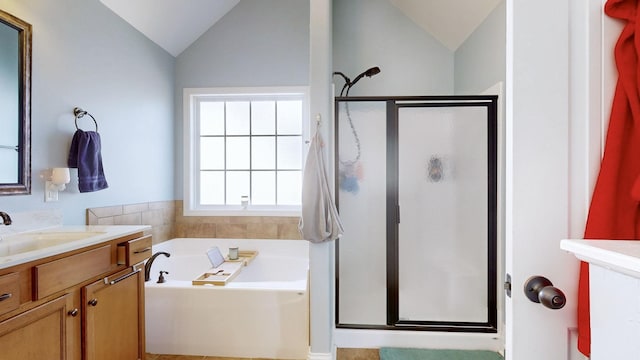 full bath featuring lofted ceiling, a stall shower, vanity, and a bath