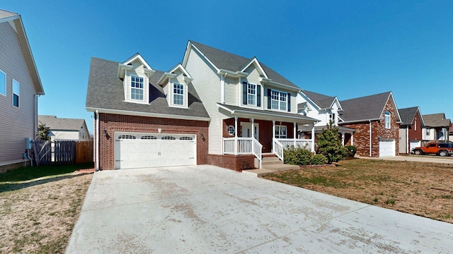 traditional-style home with an attached garage, covered porch, brick siding, fence, and concrete driveway