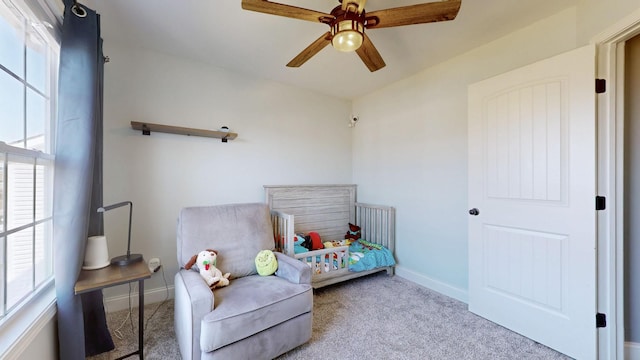 carpeted bedroom featuring a ceiling fan and baseboards