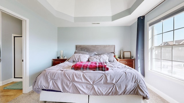 bedroom featuring visible vents and baseboards