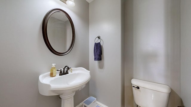 bathroom featuring toilet and a sink