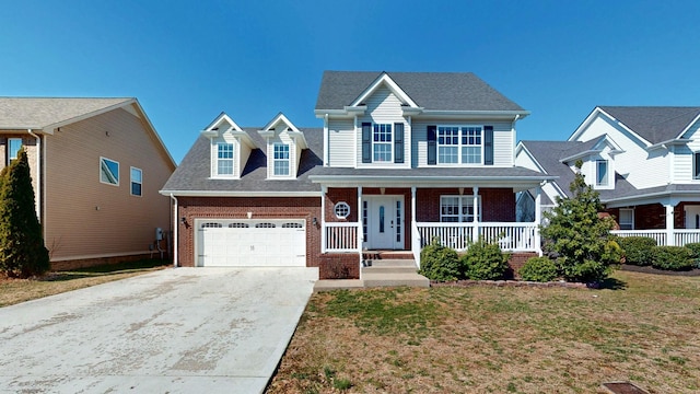 view of front of property featuring covered porch, a garage, brick siding, driveway, and a front lawn