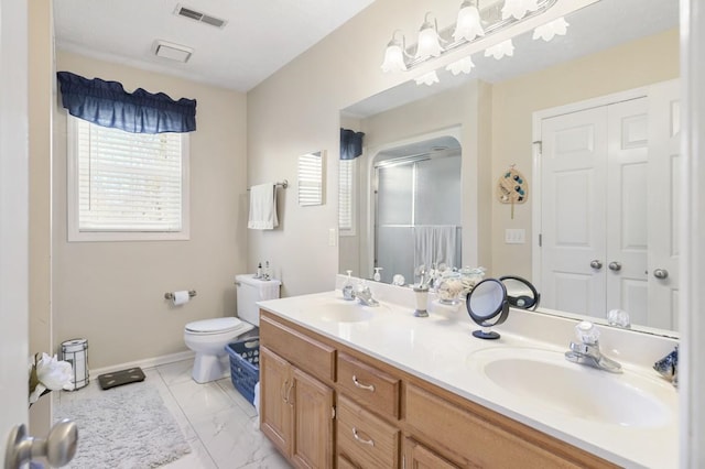 bathroom featuring marble finish floor, visible vents, a sink, and toilet