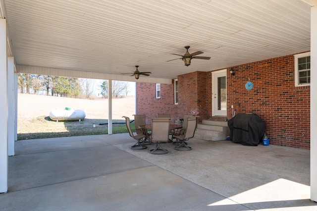 view of patio / terrace with entry steps, outdoor dining area, area for grilling, and a ceiling fan