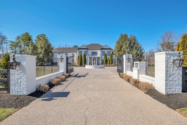 exterior space featuring driveway and a gate