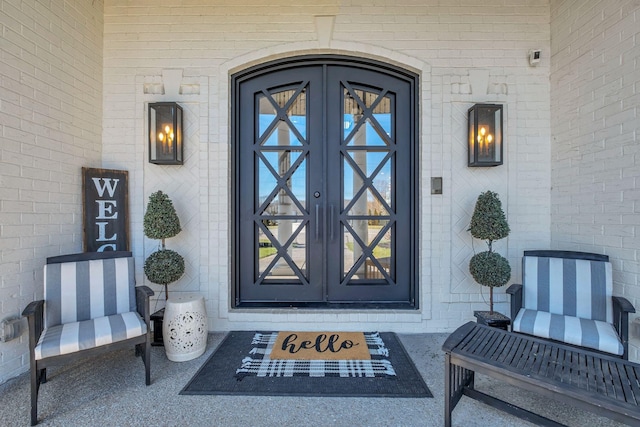 entrance to property with french doors and brick siding