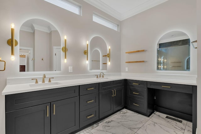 bathroom with double vanity, marble finish floor, crown molding, and a sink