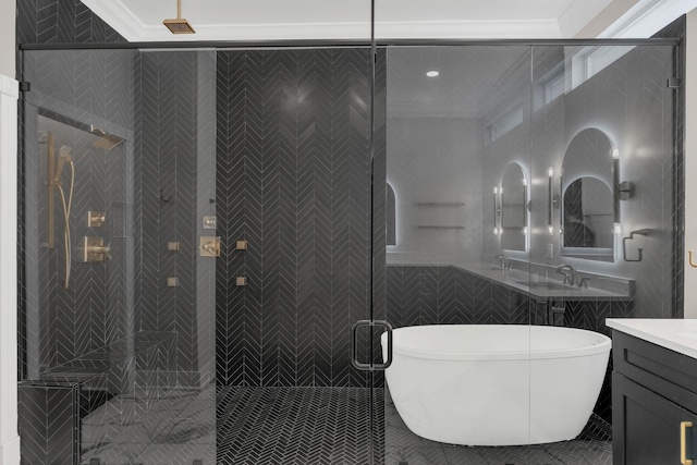 bathroom featuring a freestanding tub, a shower stall, ornamental molding, and vanity