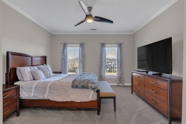 bedroom featuring baseboards, ornamental molding, ceiling fan, and light colored carpet