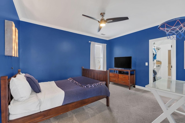 carpeted bedroom with baseboards, ceiling fan, visible vents, and crown molding