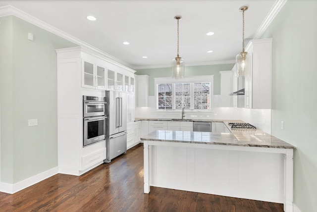 5704 Old Harding Pike, Nashville, TN 37205 - kitchen with light stone counters, a peninsula, appliances with stainless steel finishes, and white cabinets