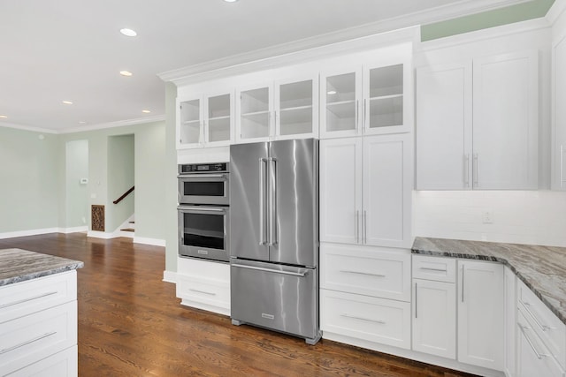 5704 Old Harding Pike, Nashville, TN 37205 - kitchen with crown molding, light stone countertops, appliances with stainless steel finishes, and glass insert cabinets