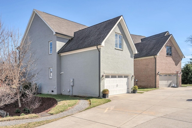 5704 Old Harding Pike, Nashville, TN 37205 - view of side of property featuring brick siding, a garage, roof with shingles, and concrete driveway