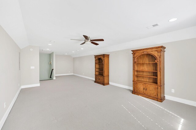 5704 Old Harding Pike, Nashville, TN 37205 - unfurnished living room with light colored carpet, visible vents, vaulted ceiling, ceiling fan, and baseboards