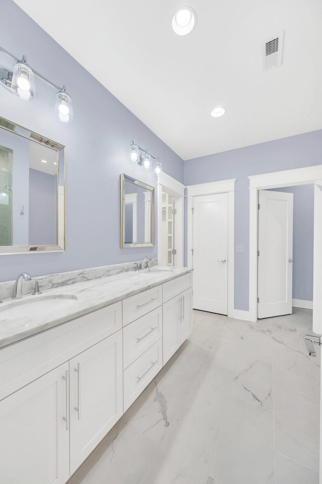 5704 Old Harding Pike, Nashville, TN 37205 - bathroom featuring a sink, double vanity, marble finish floor, and recessed lighting