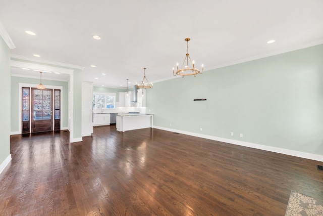 5704 Old Harding Pike, Nashville, TN 37205 - unfurnished living room featuring an inviting chandelier, ornamental molding, baseboards, and dark wood-style floors
