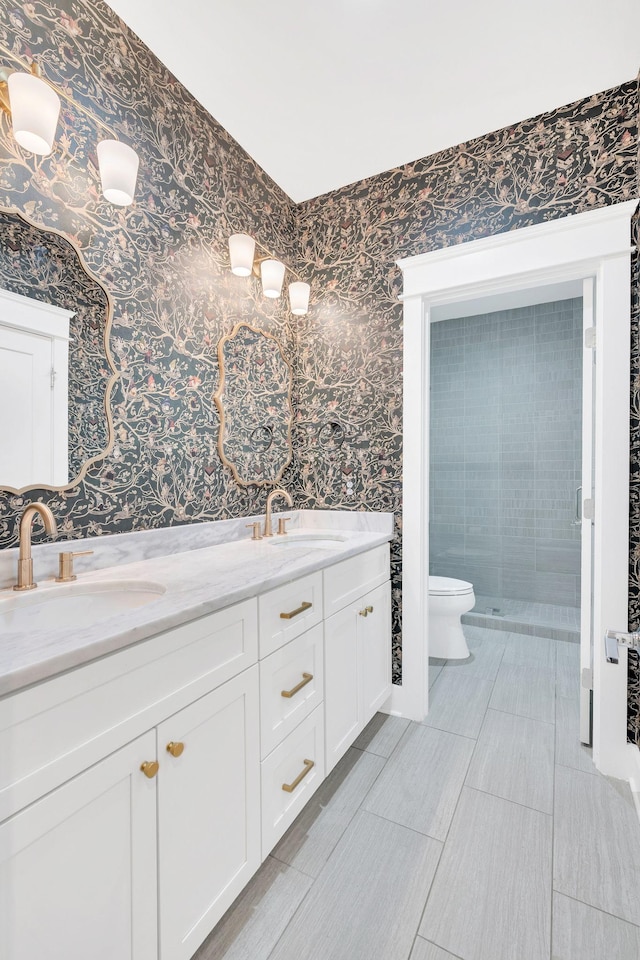5704 Old Harding Pike, Nashville, TN 37205 - bathroom with wallpapered walls, double vanity, toilet, and a shower stall