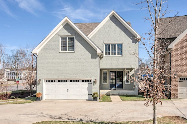 5704 Old Harding Pike, Nashville, TN 37205 - traditional-style house with a garage, brick siding, and driveway