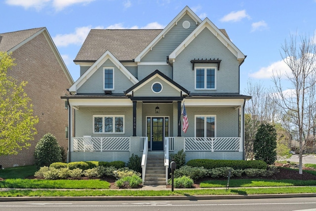 5704 Old Harding Pike, Nashville, TN 37205 - craftsman inspired home with covered porch, stairs, and brick siding