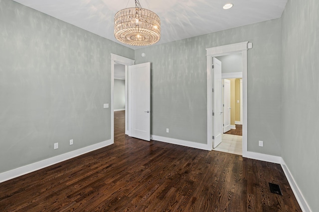 5704 Old Harding Pike, Nashville, TN 37205 - unfurnished bedroom with a chandelier, baseboards, visible vents, and wood finished floors