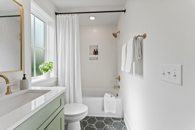 bathroom with shower / tub combo with curtain, vanity, toilet, and tile patterned floors