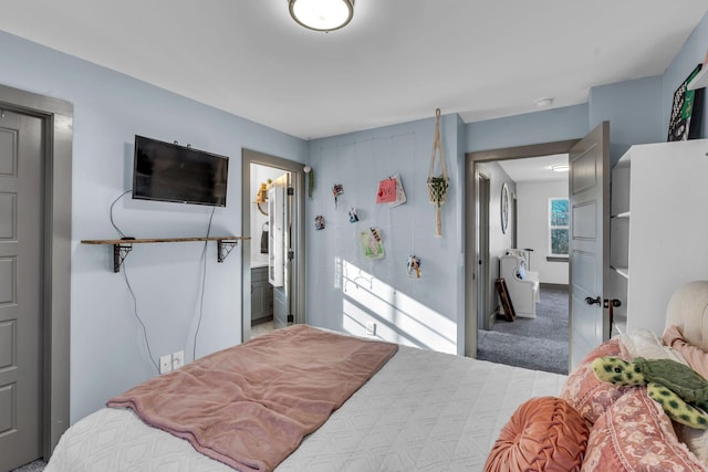 bedroom featuring carpet flooring and baseboards