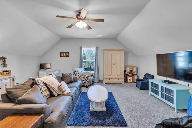 carpeted living area featuring a ceiling fan and vaulted ceiling