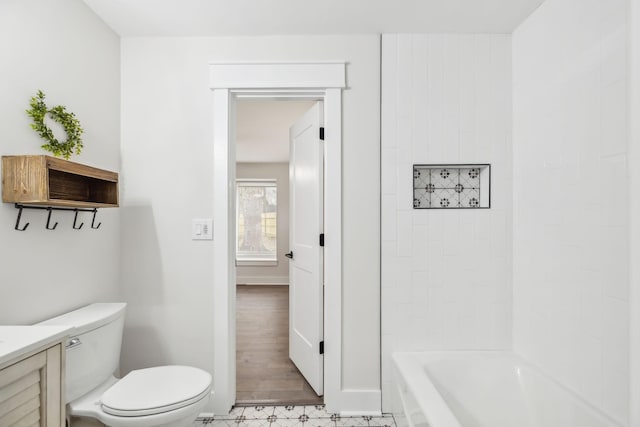 full bath featuring vanity, toilet, and baseboards