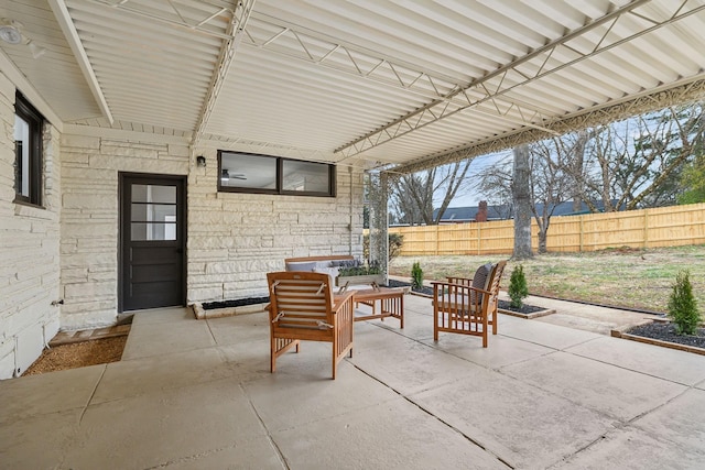 view of patio / terrace featuring fence and an outdoor living space