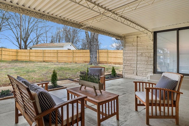 view of patio with fence and an outdoor hangout area