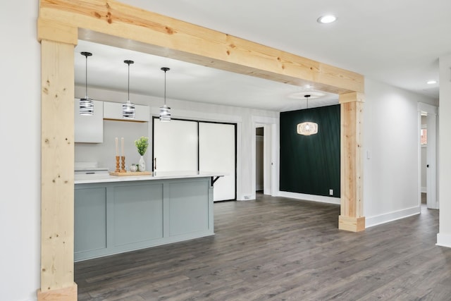 kitchen featuring recessed lighting, baseboards, light countertops, dark wood-style floors, and pendant lighting