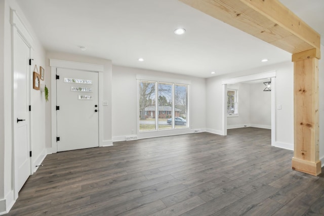 foyer entrance with baseboards, visible vents, dark wood finished floors, and recessed lighting