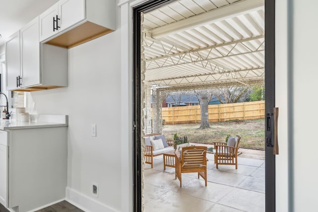 doorway to outside with baseboards