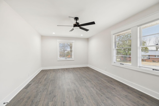 empty room featuring baseboards, visible vents, ceiling fan, dark wood-type flooring, and recessed lighting