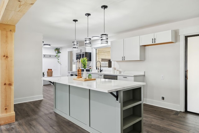 kitchen with a kitchen island, white cabinets, dark wood finished floors, and open shelves