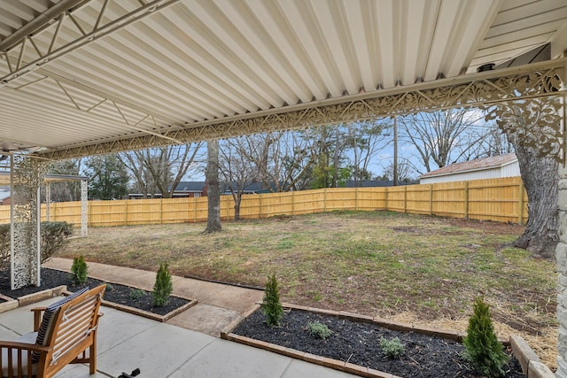 view of yard with a fenced backyard and a patio