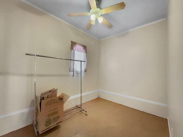 spare room featuring ornamental molding and ceiling fan