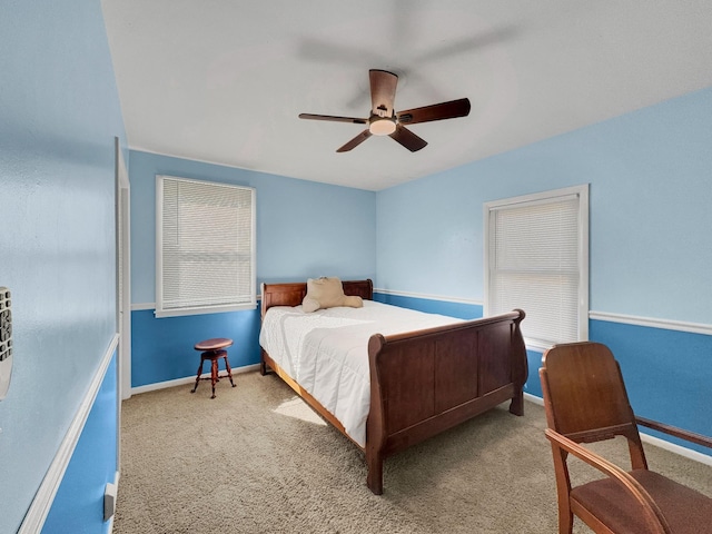 bedroom featuring carpet, baseboards, and a ceiling fan