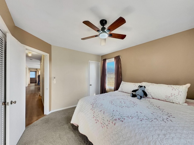 bedroom featuring ceiling fan, carpet floors, and baseboards