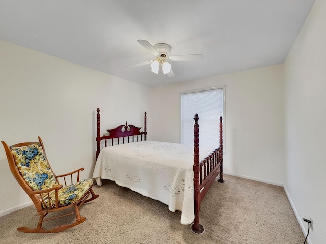 carpeted bedroom featuring a ceiling fan and baseboards