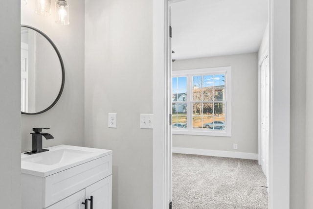 bathroom with baseboards and vanity