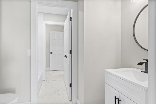 bathroom featuring toilet, vanity, baseboards, marble finish floor, and a shower