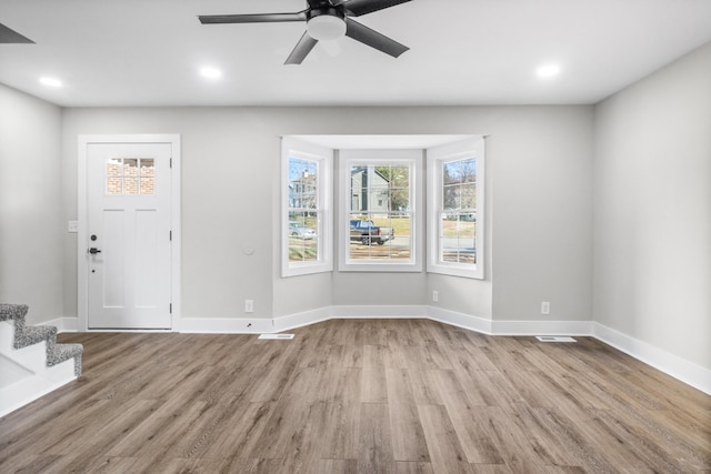 entrance foyer featuring recessed lighting, baseboards, and wood finished floors